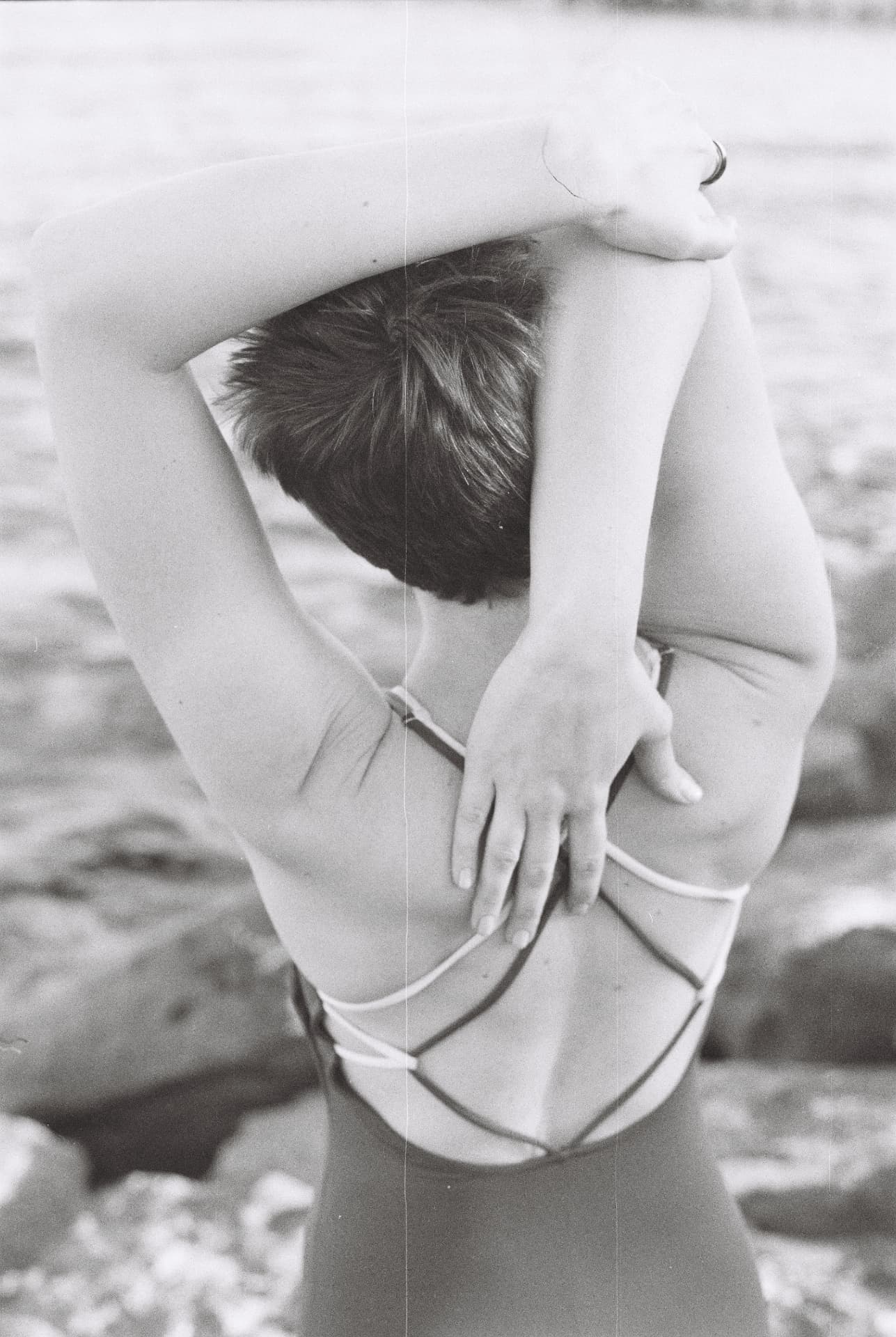 Black and white shoulder stretch on the beach